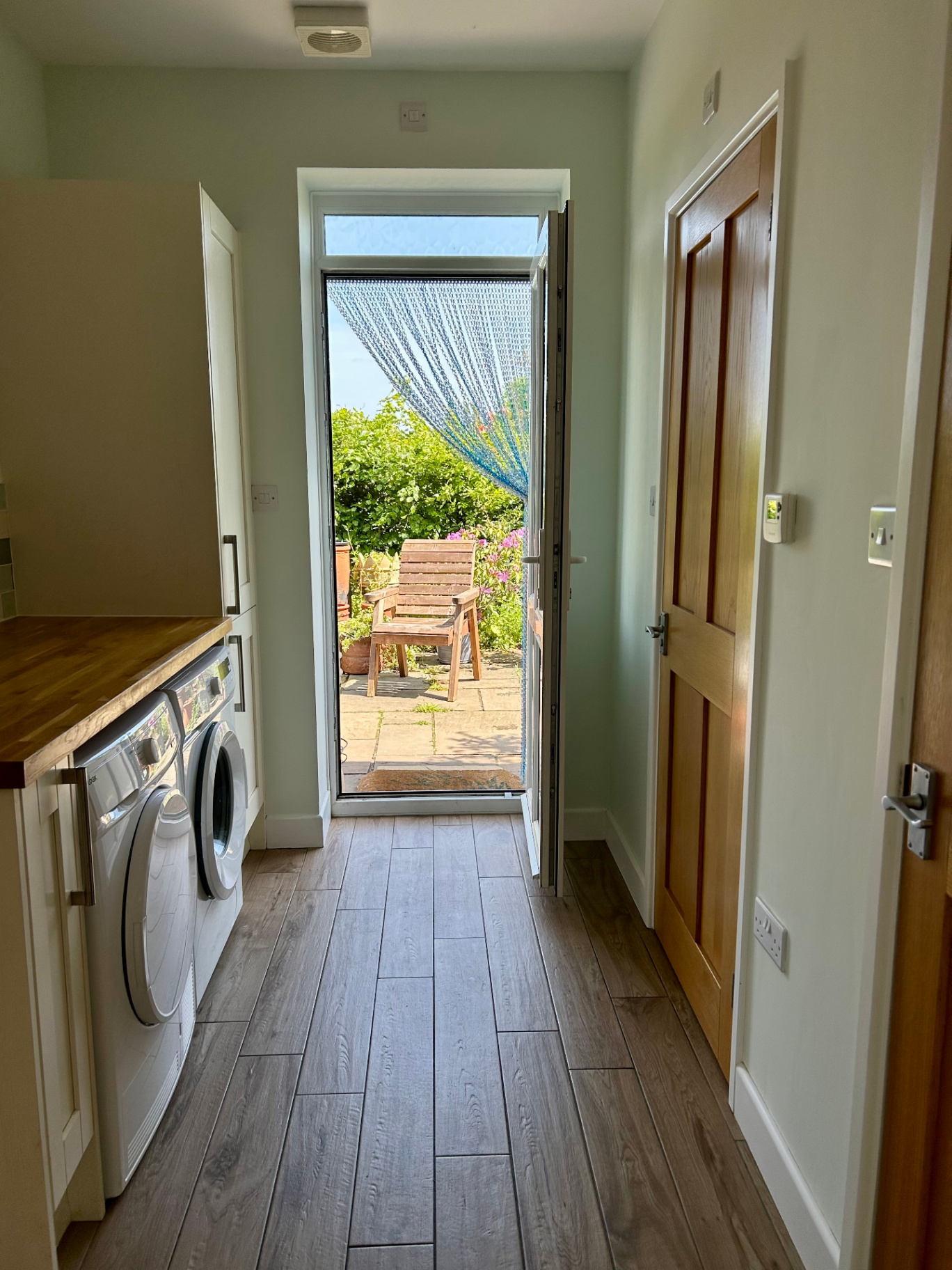 Finished decorating project in Thurleigh showing a bright utility space.