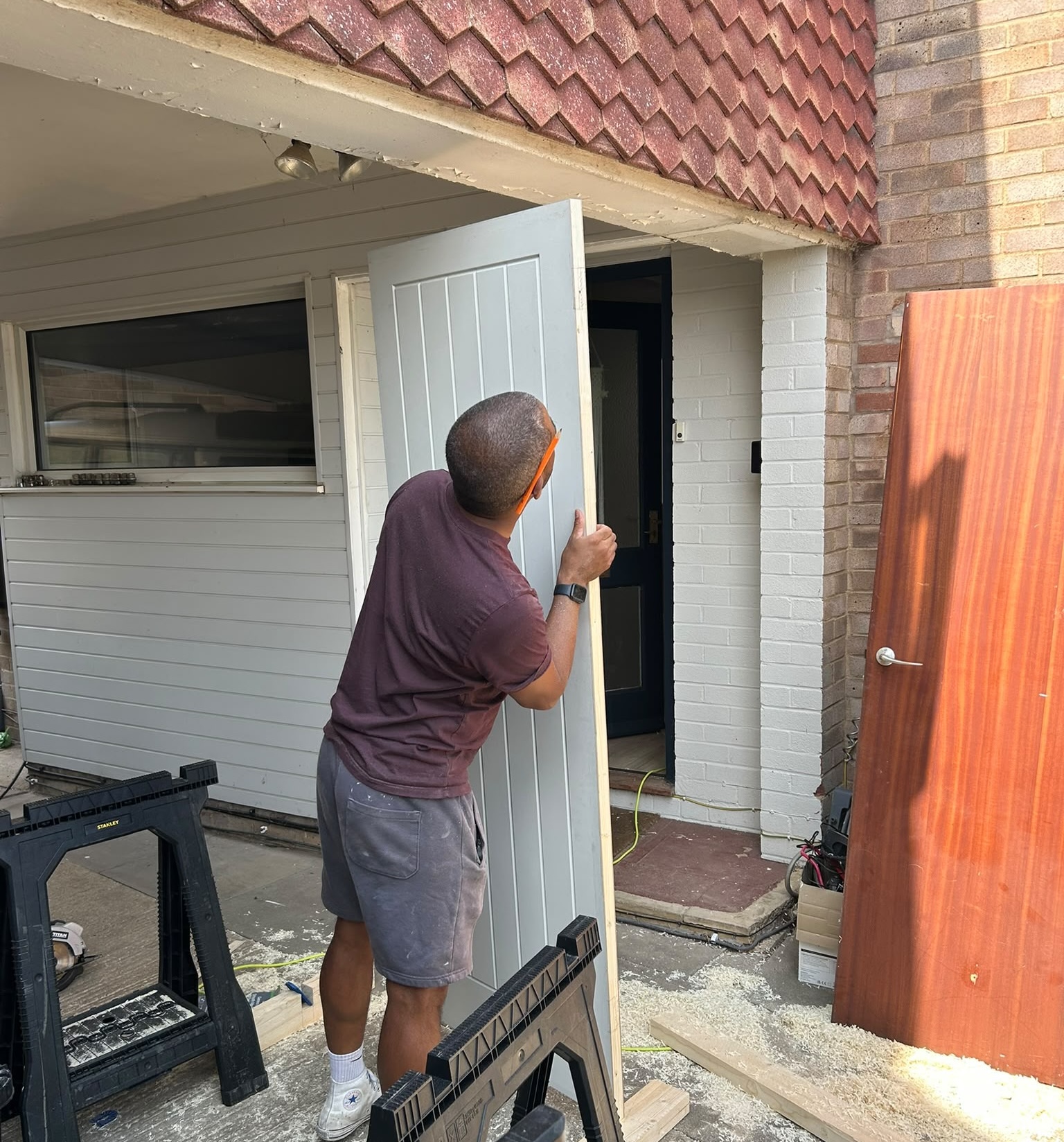Ricky fitting a new internal door during an installation project in Felmersham, Bedfordshire.