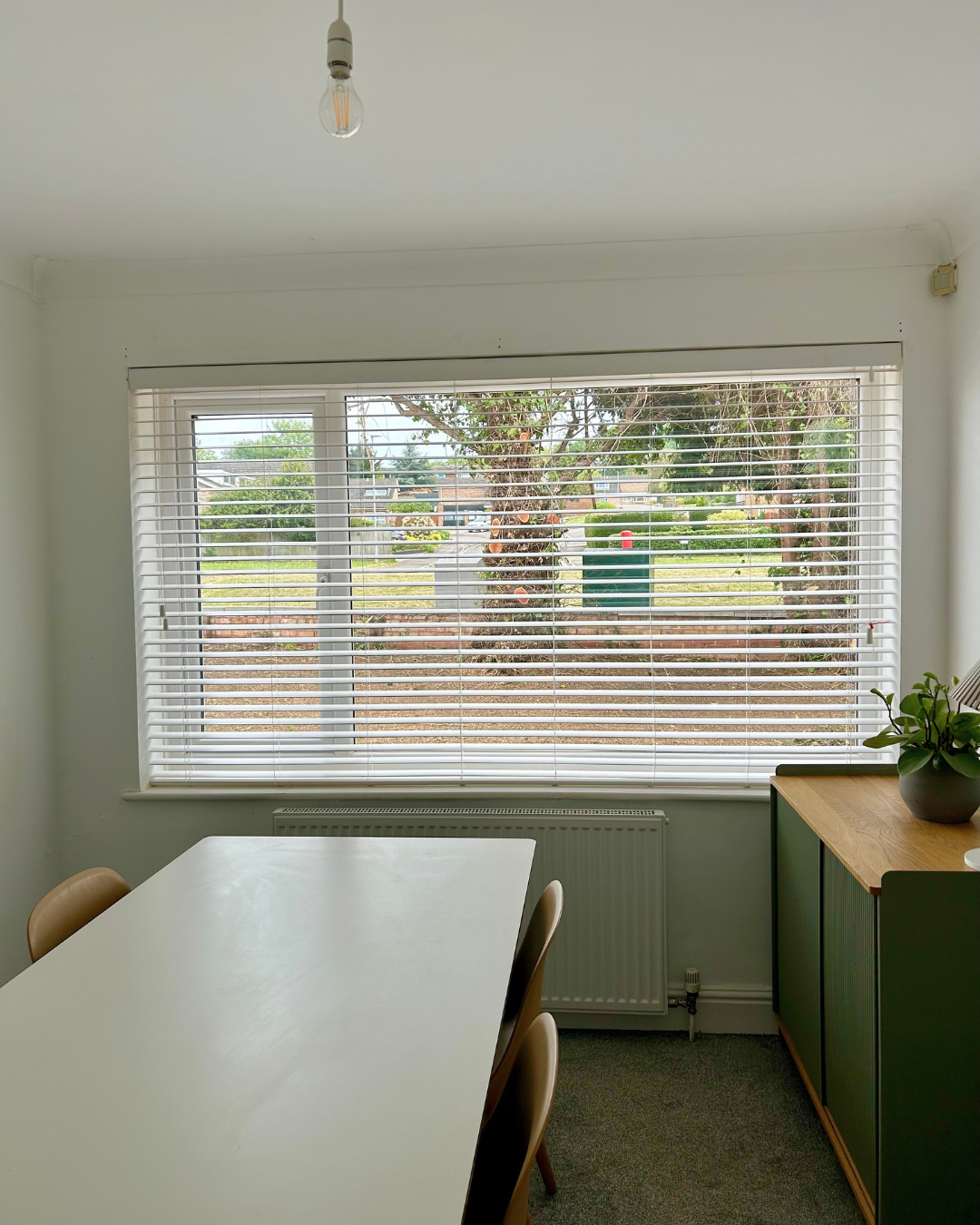Finished blind installation in a Bedford home completed by OUTTUU.