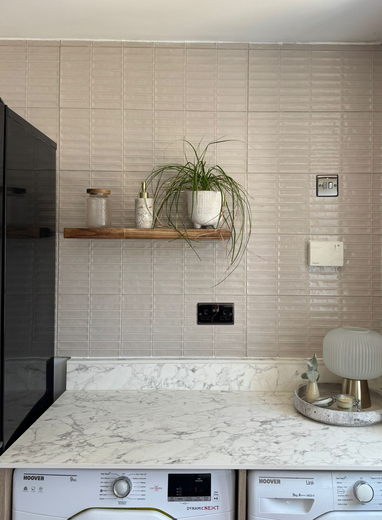 Stacked ceramic kitchen wall tiling completed by OUTTUU in Bedford.